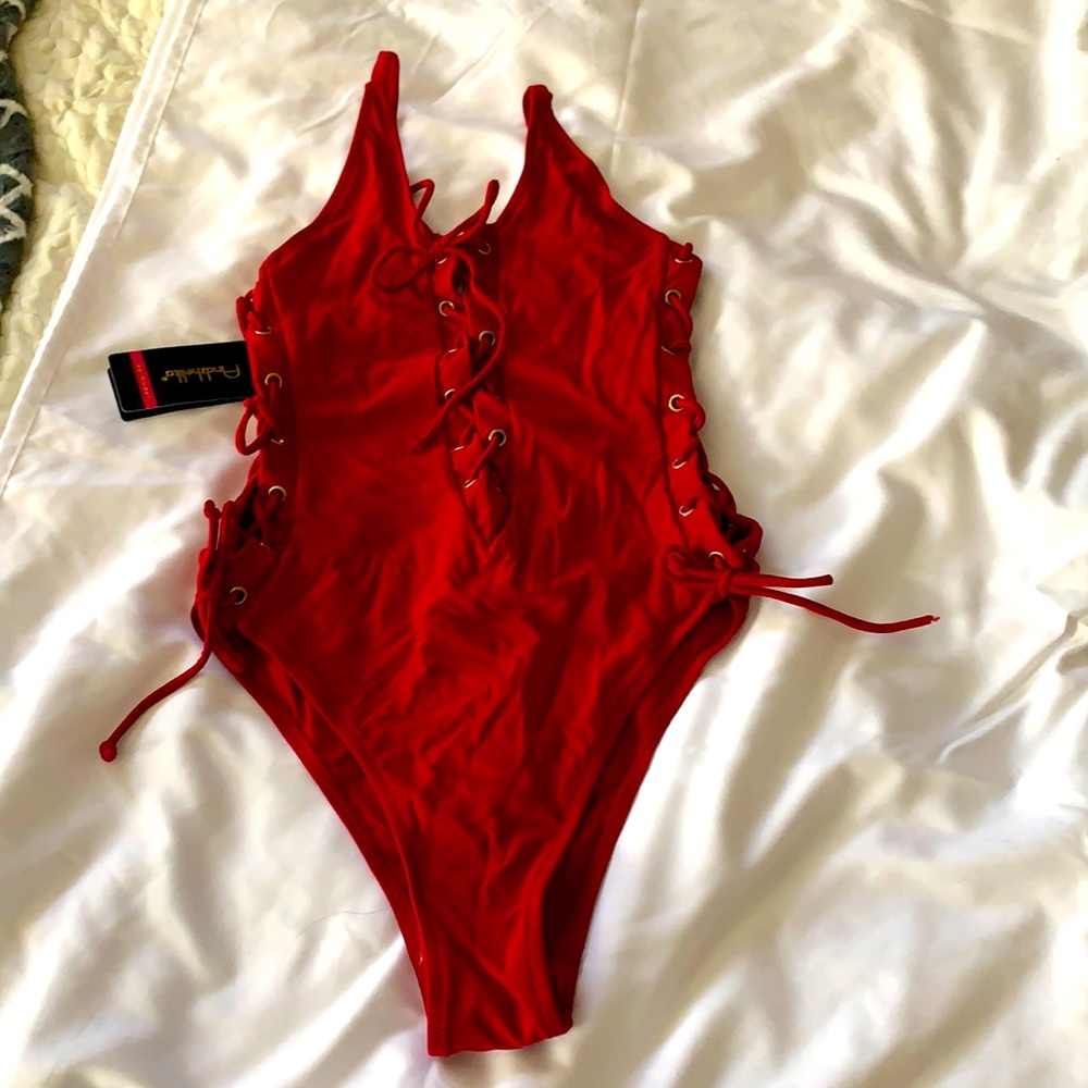 Brand new never worn one piece of red bathing suit size medium